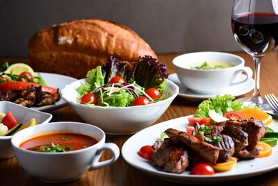 Assortment of gourmet dishes with wine
