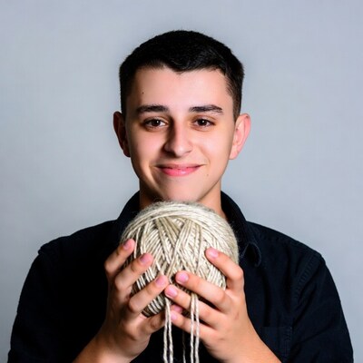 Boy holding yarn ball