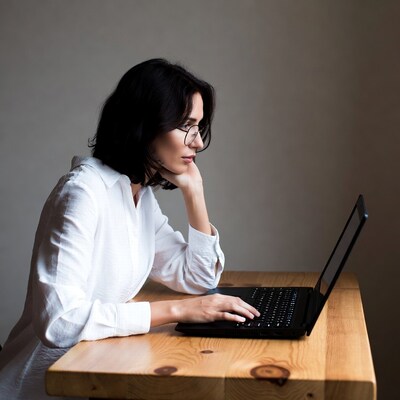 Woman working on laptop at desk
