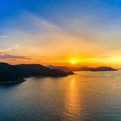Sunset over coastal mountains and sea