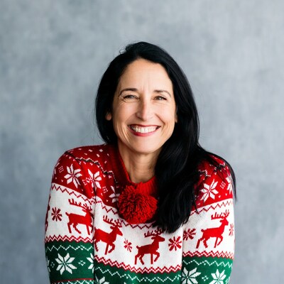 Smiling woman in reindeer Christmas sweater