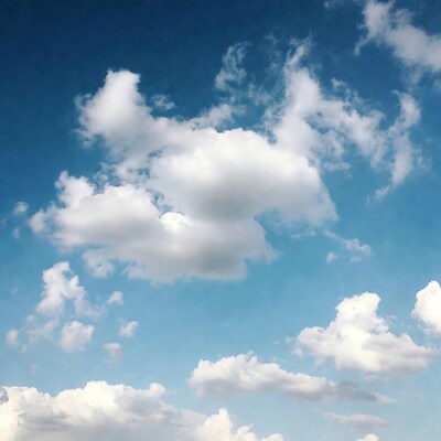 Fluffy white clouds in blue sky