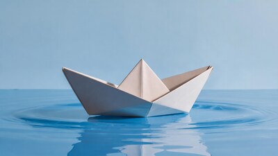Paper Boat on Blue Water
