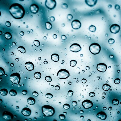 Water droplets on blue glass