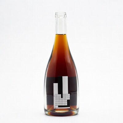 Amber liquid bottle with geometric label