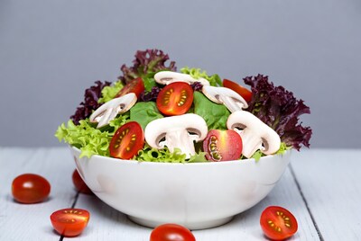 Fresh salad with mushrooms and tomatoes