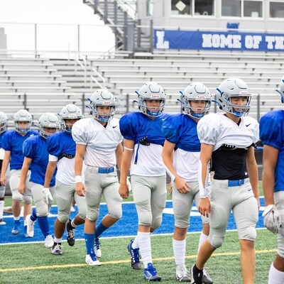 Football team boys walking on field
