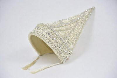 White beaded conical hat with tassels
