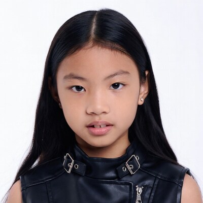 Asian girl in black leather vest