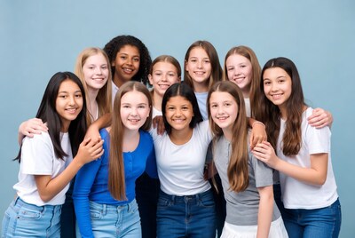 Group of diverse teenage girls hugging