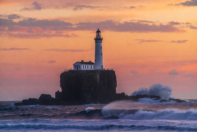 Lighthouse on Rocky Island at Sunset