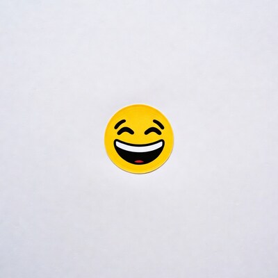 Yellow laughing face emoji