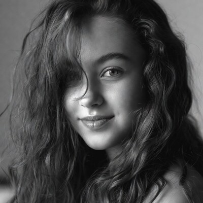 Young woman with wavy hair smiling