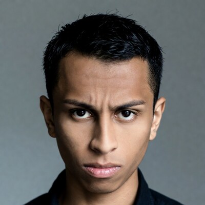 Young Asian man with puzzled expression