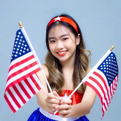 Asian woman holding American flags