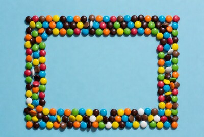 Colorful Candy Frame on Blue Background