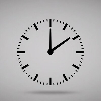 Black analog clock showing 10:10