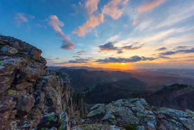 Sunset over Mountain Range from Cliff
