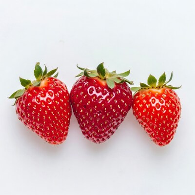 Three Fresh Strawberries on White