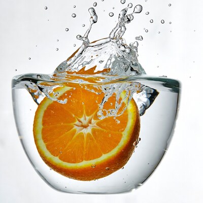 Orange Slice in Splashing Water Glass