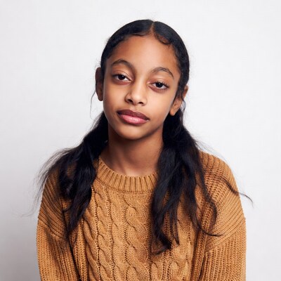 African-American girl in orange sweater
