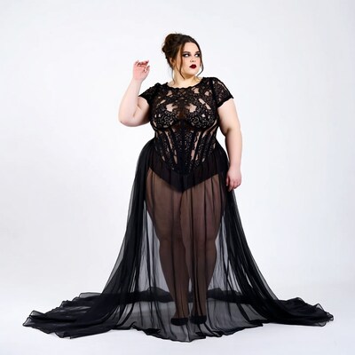 Curvy woman in black lace gown