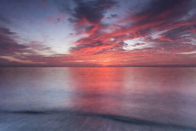Vibrant Sunset Over Calm Ocean