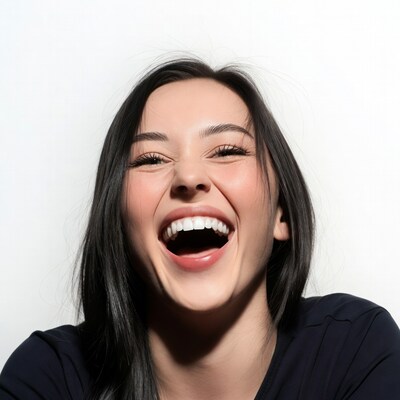 Asian woman laughing with wide smile