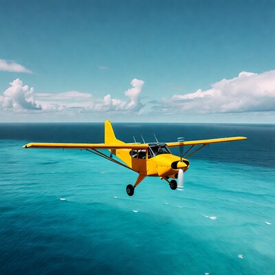 Yellow seaplane flying over ocean