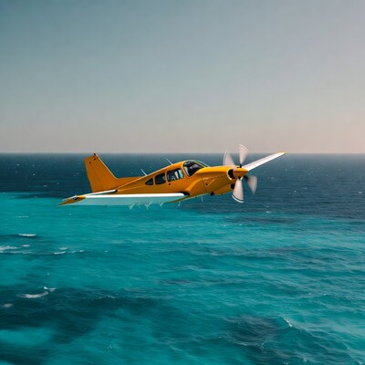 Yellow propeller plane flying over ocean