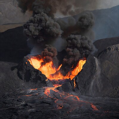 Active volcano erupting lava and ash