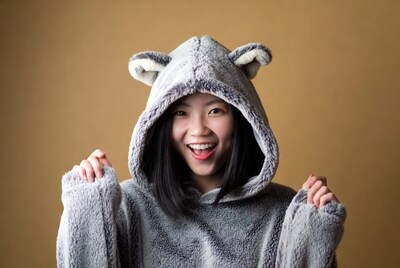 Asian girl in wolf ear hoodie smiling