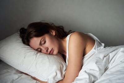 Woman sleeping peacefully in bed