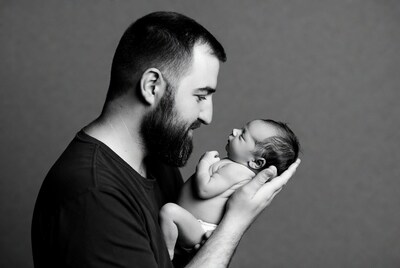 Father holding newborn baby