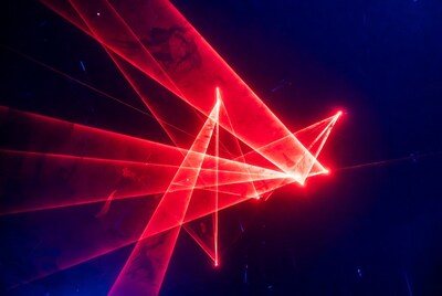 Red laser beams on dark blue background