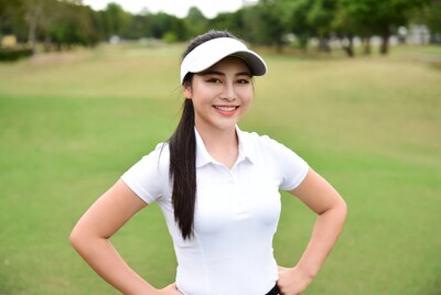 Asian woman golfer on green