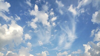Fluffy Clouds in Blue Sky