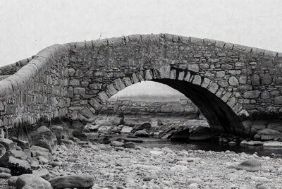 Stone Arch Bridge over Rocky Stream