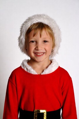 Girl in Santa costume smiling