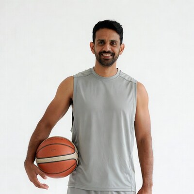 Indian man holding basketball