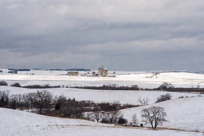 Grain Silos in Snowy Fields