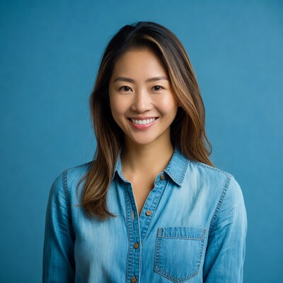 Asian woman smiling in denim shirt