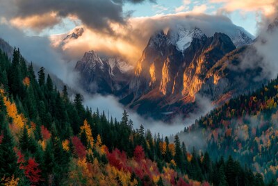 Snowy Mountains with Fall Foliage and Clouds