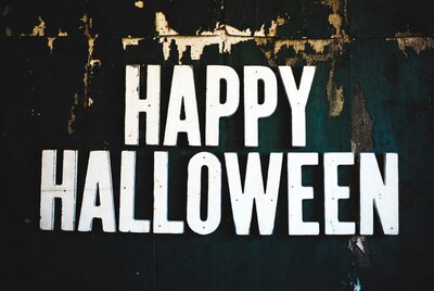 Happy Halloween sign on rustic wall