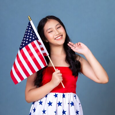 Asian girl waving American flag
