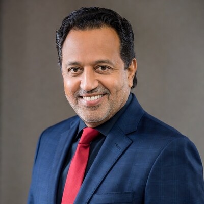 Smiling Middle Eastern man in blue suit