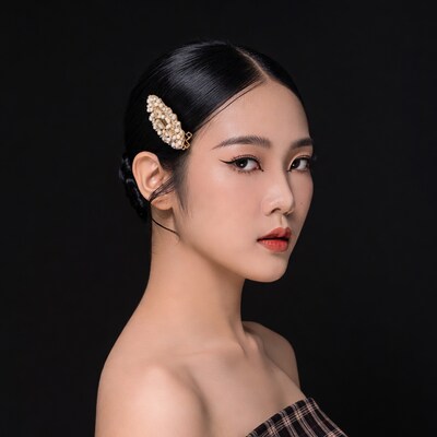 Asian woman with pearl hair clip