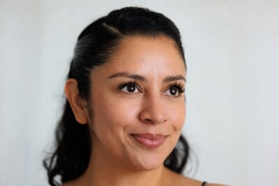 Latina woman smiling on white background