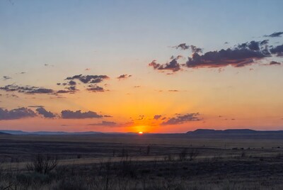 Sunset over vast desert plains