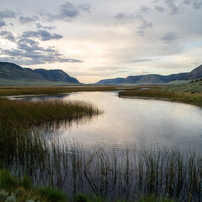 Marsh River Sunset with Mountains